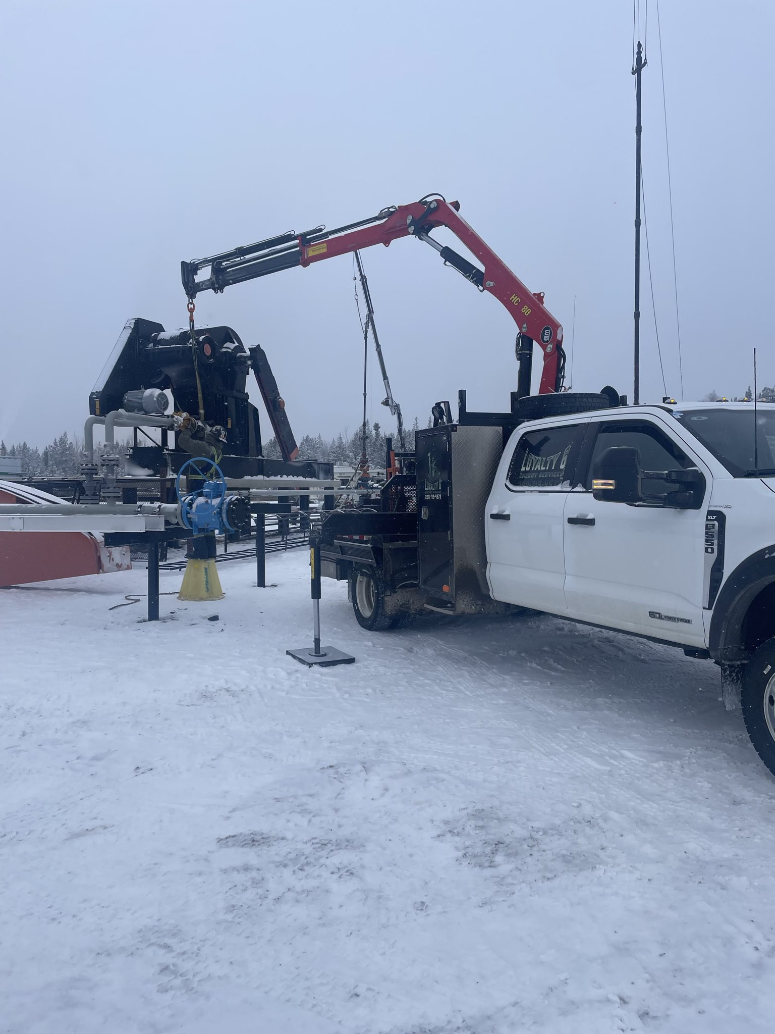 Crane truck lifting equipment on site