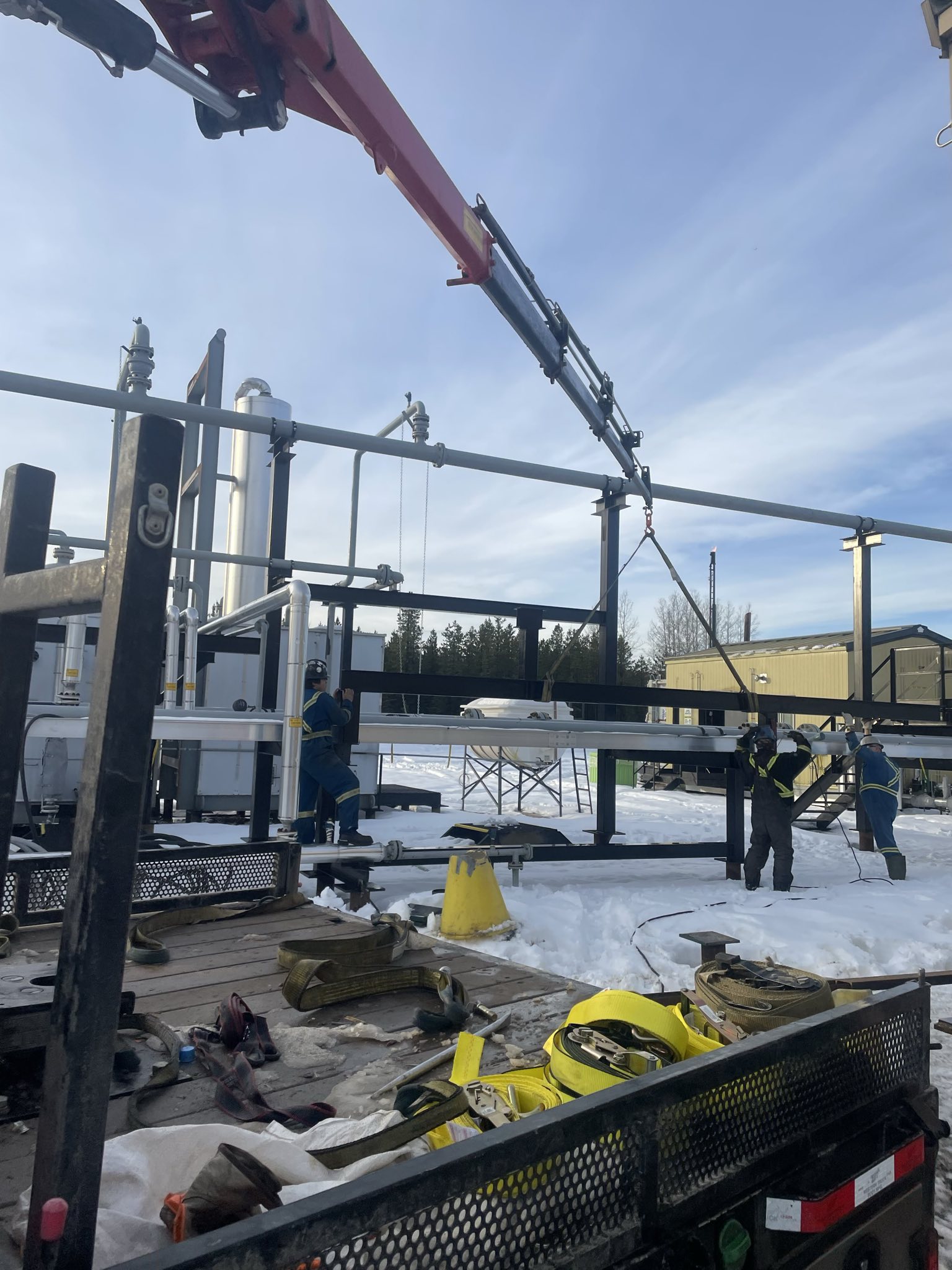 Crew working at facility with crane