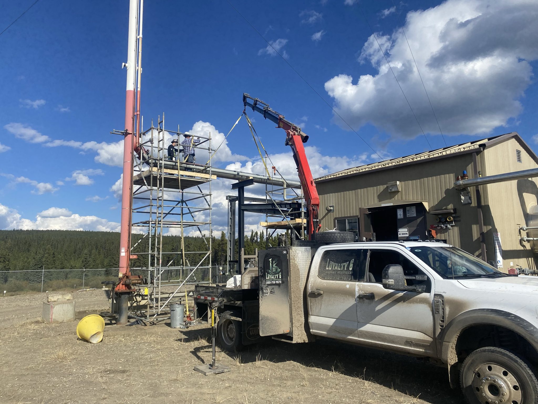 Loyalty6 truck and crane at scaffolded facility