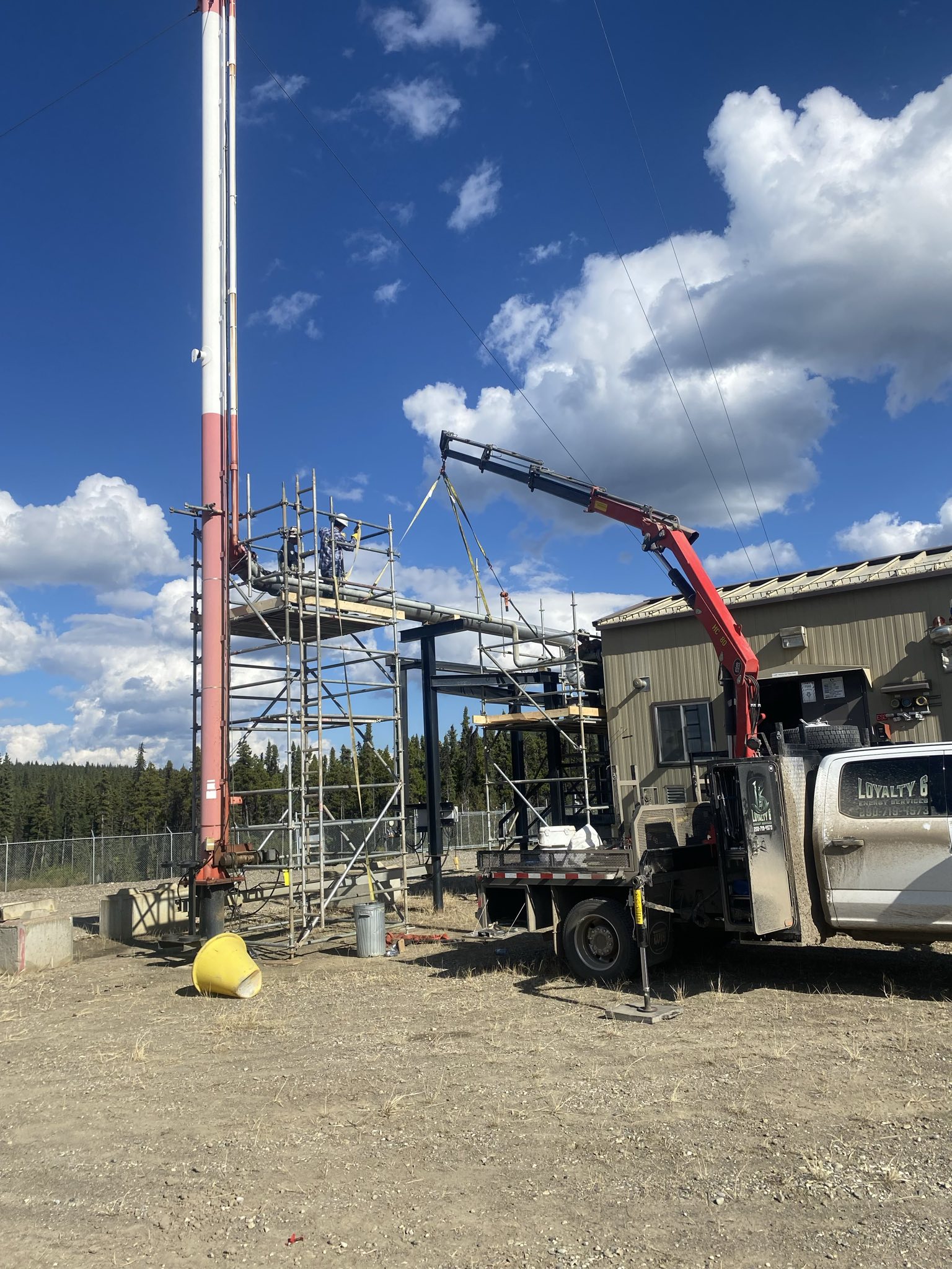 Crane work at facility with scaffolding